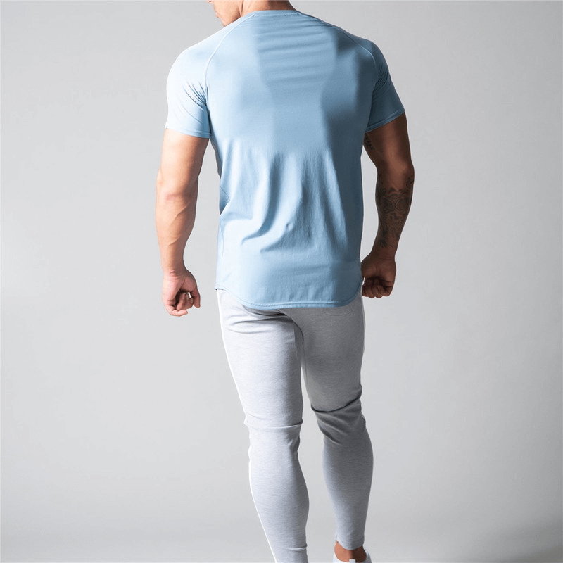 Rear view of man wearing a blue running cotton t-shirt with striped sleeves, showcasing stylish comfort for men - SF1239